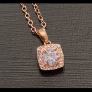 Delicate rose gold chain necklace with diamond like pendant